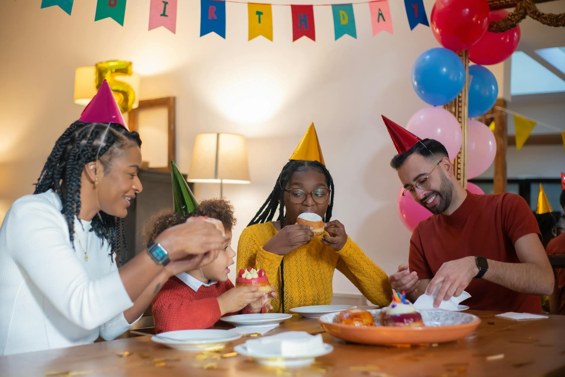 Family celebrating birthday with party games